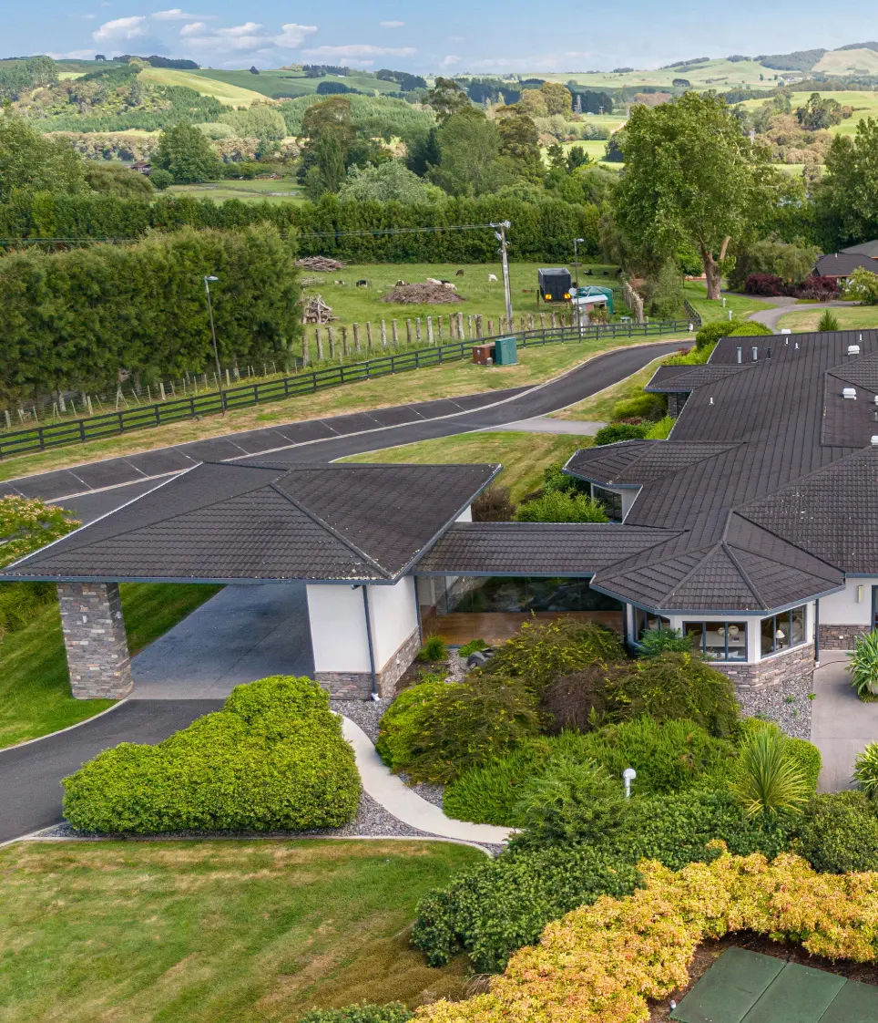 Karapiro Villas Resort buildings and gardens overlooking the countryside