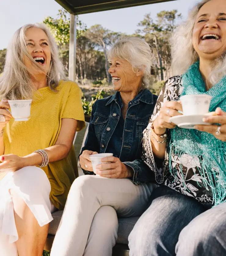Friends enjoying tea together outdoors