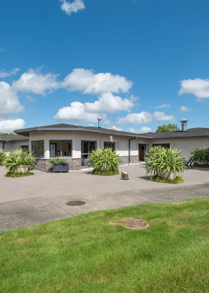 Exterior of the villas and landscaped grounds at Karapiro Villas Resort